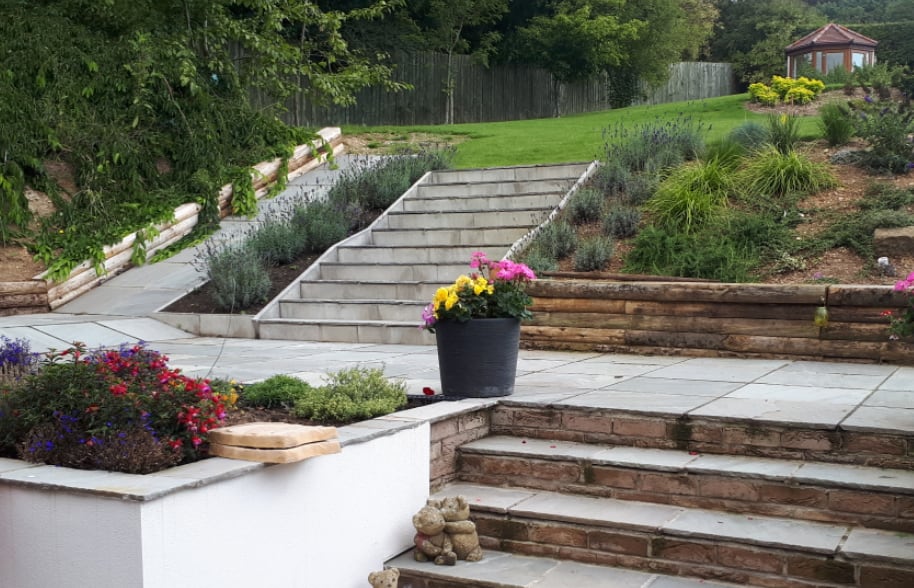 Newly terraced garden with sandstone steps, retaining walls and lawn completed by Level Groundworks near Hull